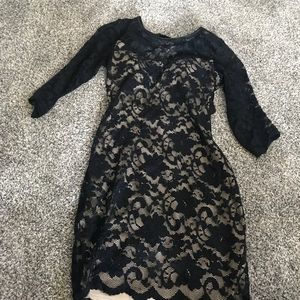 Black lace over beige material with open back